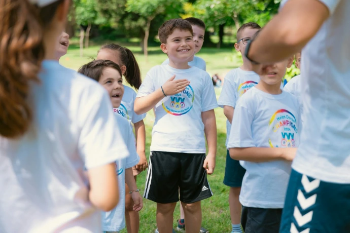a group of young children standing next to each other